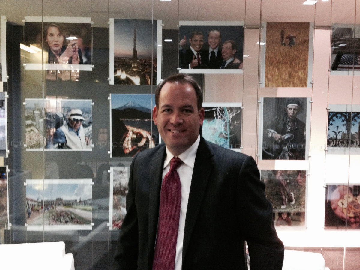 Jason Cardiff in a dark suit and burgundy tie